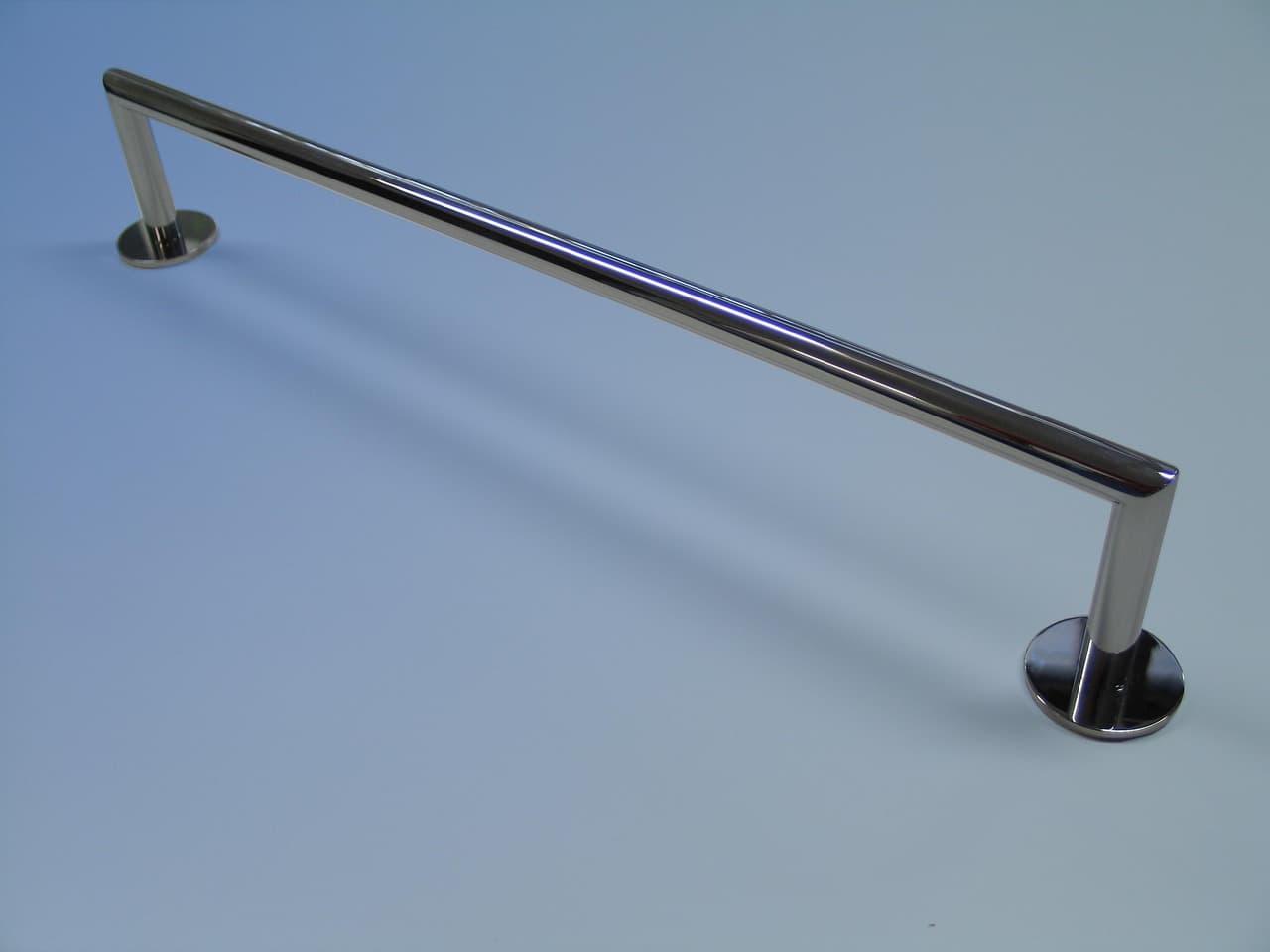 Bathroom towel bar and fixtures mounted on wall